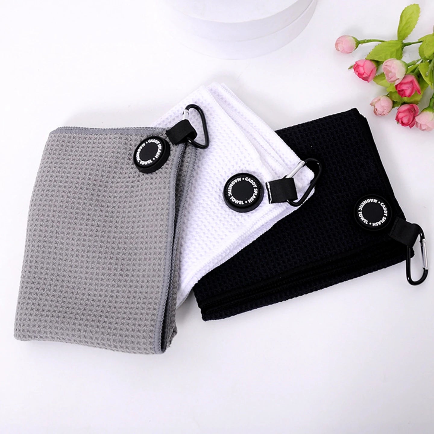 Waffle golf towel with magnetic attachment