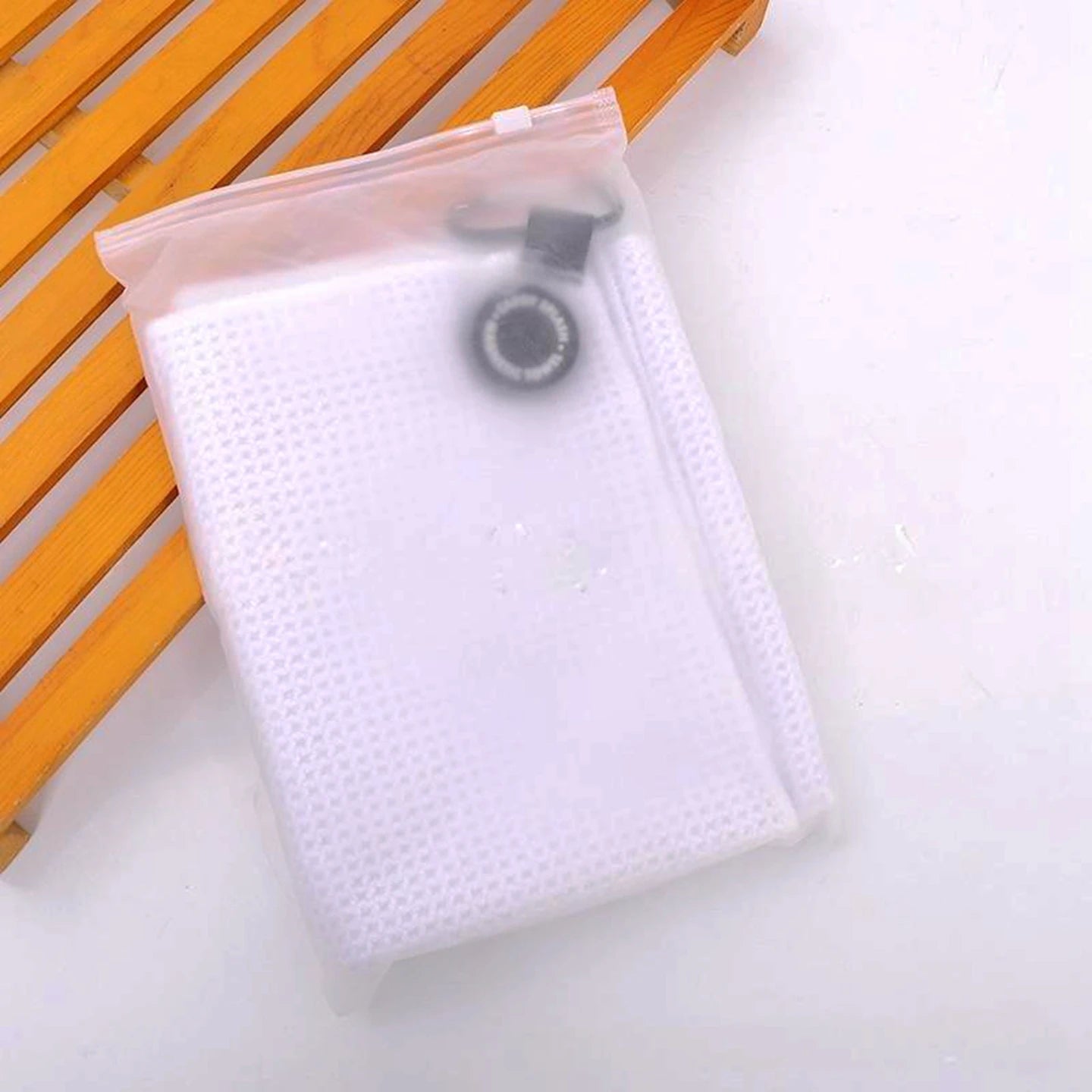 Waffle golf towel with magnetic attachment