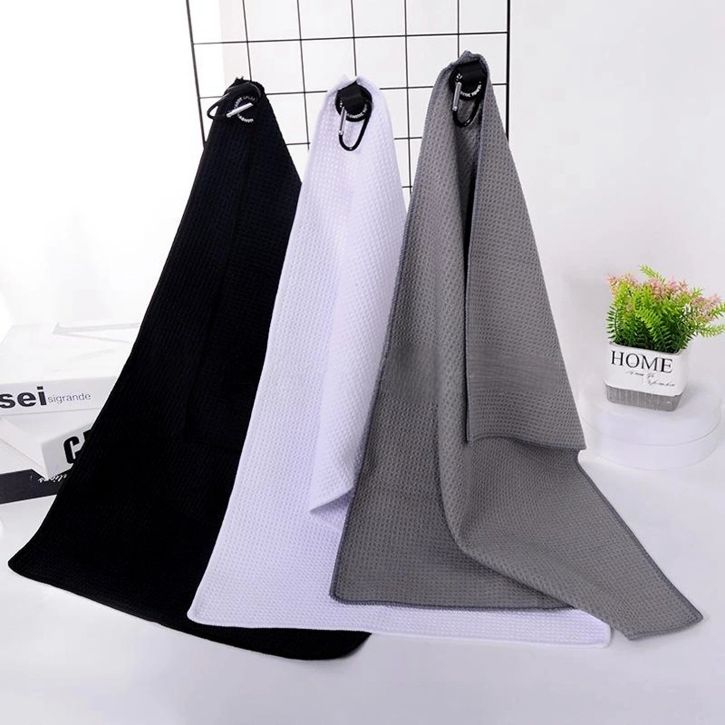 Waffle golf towel with magnetic attachment